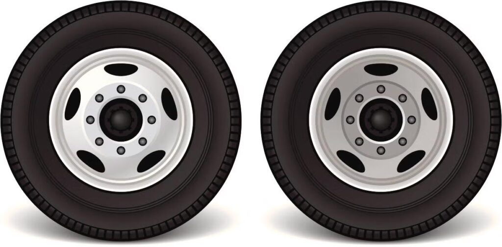 Two tires displayed on a white background, showcasing their design and texture.